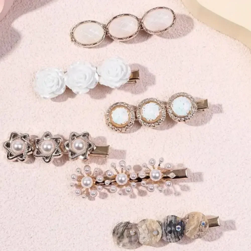 6 piece goldtone pearl shell clip set